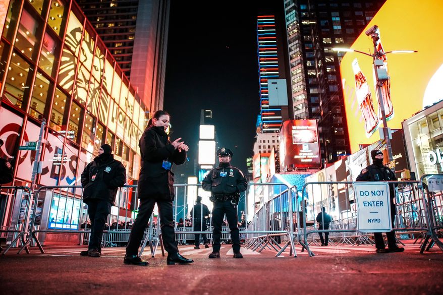 NYPD officers stand guard in Times Square during New Year's Eve celebrations, Wednesday, Dec. 31, 2025, in New York. (AP Photo/Eduardo Munoz Alvarez) **FILE**