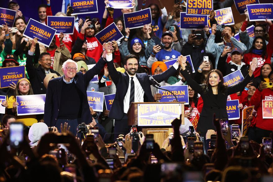 FILE - Sen. Bernie Sanders, I-Vt., left, New York City mayoral candidate Zohran Mamdani, center, and Rep. Alexandria Ocasio-Cortez, D-N.Y., appear on stage during a rally, Sunday, Oct. 26, 2025, in New York. (AP Photo/Heather Khalifa, File)