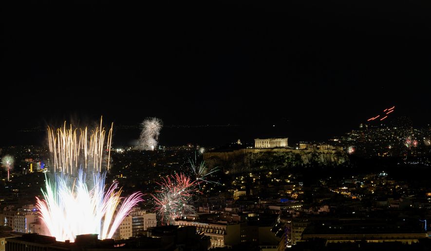 Fireworks burst over the Greek capital during New Year celebrations in Athens, Greece, early Thursday, Jan. 1, 2026. (AP Photo/Yorgos Karahalis)
