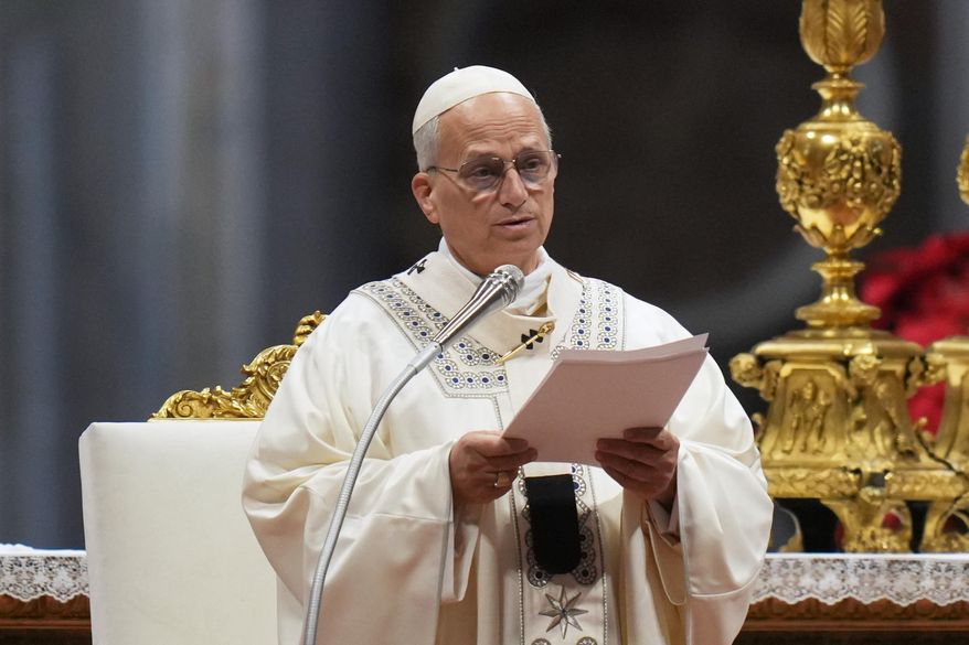Pope Leo XIV reads the homily as he celebrates Mass on New Year's Day, in St. Peter's Basilica at the Vatican, Thursday, Jan. 1, 2026. (AP Photo/Alessandra Tarantino)