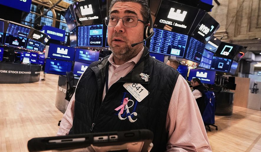 Trader Michael Capolino works on the floor of the New York Stock Exchange, Friday, Jan. 2, 2026. (AP Photo/Richard Drew)