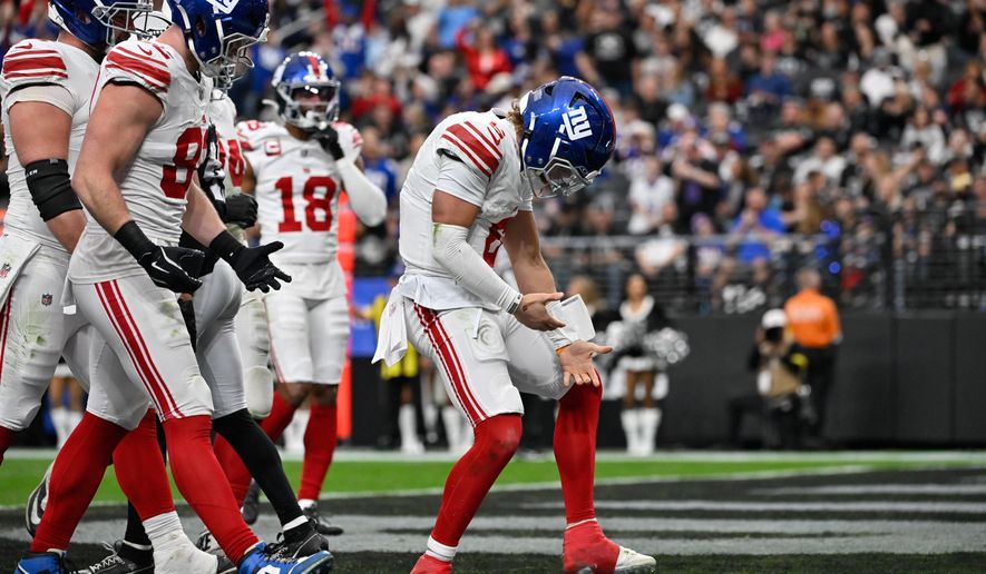 New York Giants quarterback Jaxson Dart (6) celebrates his touchdown during the first half of an NFL football game against the Las Vegas Raiders Sunday, Dec. 28, 2025, in Las Vegas. (AP Photo/David Becker)