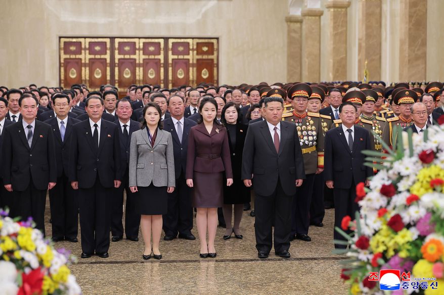 In this photo provided by the North Korean government, leader Kim Jong Un, center right, his wife Ri Sol Ju, third left, and their daughter, center, believed to be named Kim Ju Ae, visit Kumsusan Palace of the Sun in Pyongyang, North Korea, Thursday, Jan. 1, 2026. Independent journalists were not given access to cover the event depicted in this image distributed by the North Korean government. The content of this image is as provided and cannot be independently verified. Korean language watermark on image as provided by source reads: "KCNA" which is the abbreviation for Korean Central News Agency. (Korean Central News Agency/Korea News Service via AP)
