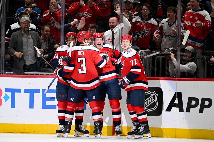 Washington Capitals forward Ryan Leonard (9) celebrating with teammates after scoring a goal during the third period of an NHL game against the Chicago Blackhawks at Capital One Arena in Washington D.C., January 3, 2026. (Photo for the Washington Times)