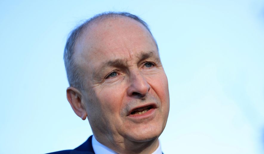 Micheal Martin, Tanaiste of Ireland and leader of Fianna Fail speaks to the media during a visit to St Seton's Secondary School in Ballyfermot, Dublin, Ireland, Tuesday, Nov. 26, 2024. (AP Photo/Peter Morrison, File)