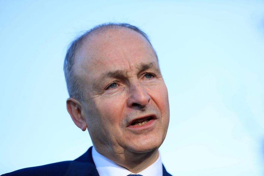 Micheal Martin, Tanaiste of Ireland and leader of Fianna Fail speaks to the media during a visit to St Seton's Secondary School in Ballyfermot, Dublin, Ireland, Tuesday, Nov. 26, 2024. (AP Photo/Peter Morrison, File)