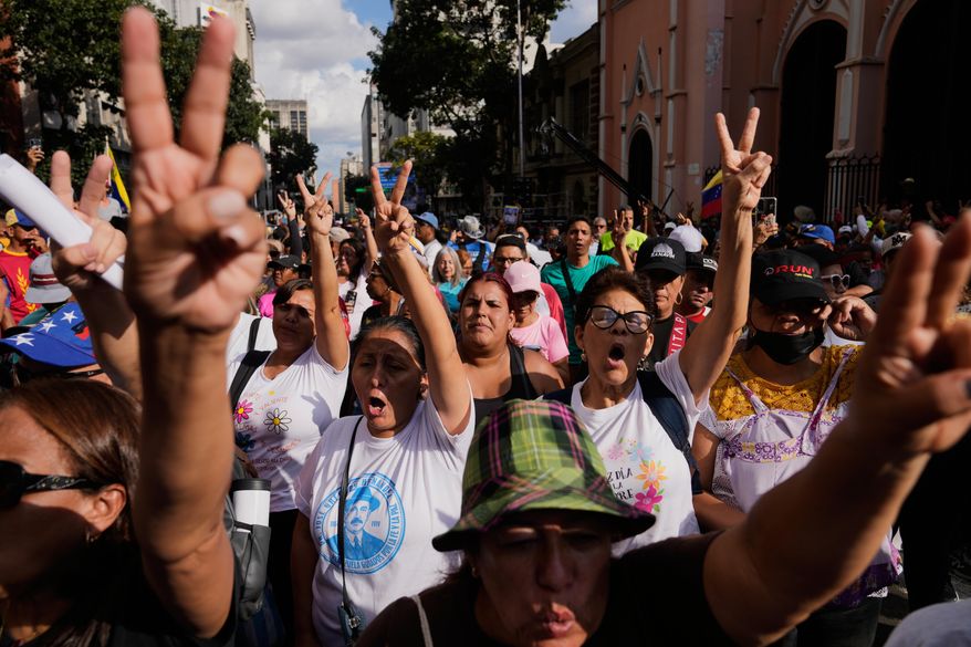 Government supporters demand President Nicolas Maduro's release from U.S. custody during a protest in Caracas, Venezuela, Sunday, Jan. 4, 2026. (AP Photo/Ariana Cubillos)