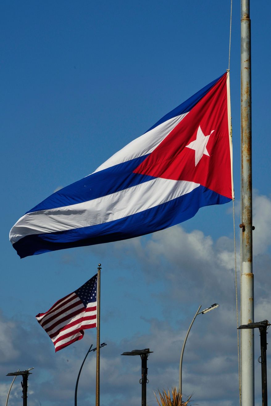 The Cuban flag flies at half-mast at the Anti-Imperialist Tribune near the U.S. embassy in Havana, Cuba, Monday, Jan. 5, 2026, in memory of Cubans who died two days before in Caracas, Venezuela during the capture of Venezuelan President Nicolas Maduro by U.S. forces. (AP Photo/Ramon Espinosa)