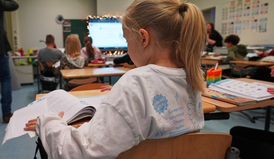 A young student works during a media literacy class at Tapanila Primary School in Tapanila, Finland, on Dec. 9, 2025. (AP Photo/James Brooks)