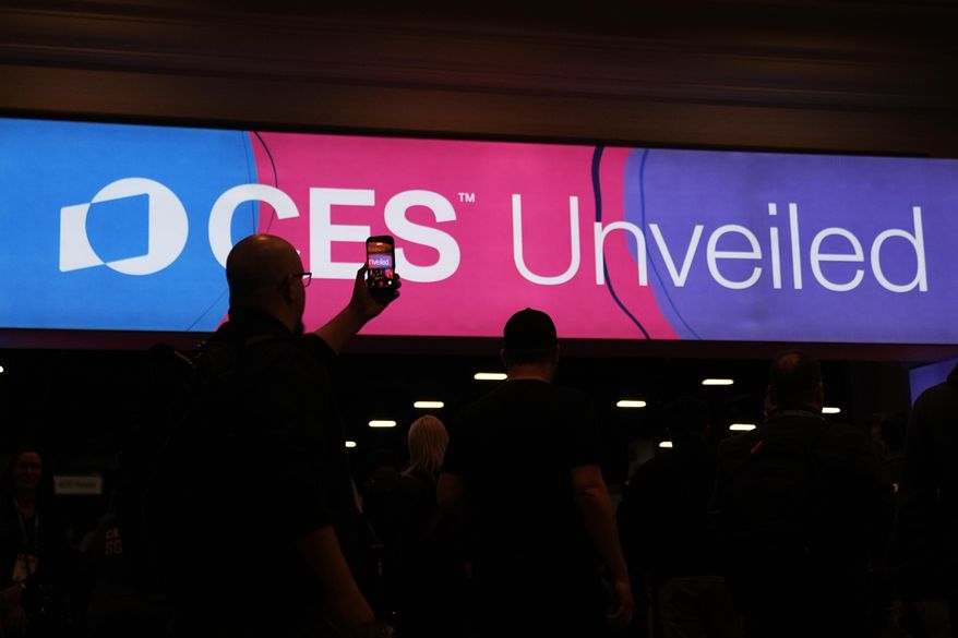 People arrive at the CES Unveiled tech show Sunday, Jan. 4, 2026, in Las Vegas. (AP Photo/Abbie Parr)