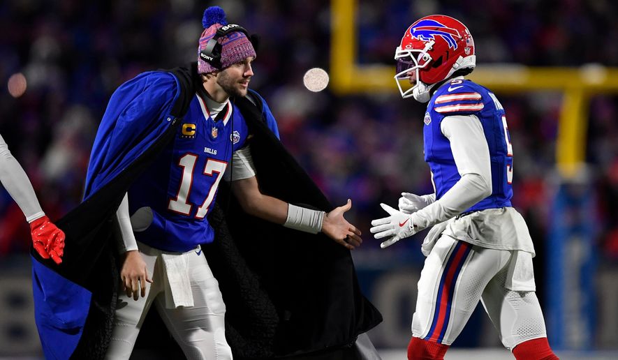 Buffalo Bills quarterback Josh Allen (17) congratulates wide receiver Joshua Palmer (5) after the Bills scored a touchdown against the New York Jets in the second half of an NFL football game Sunday, Jan. 4, 2026, in Orchard Park, N.Y. (AP Photo/Adrian Kraus)