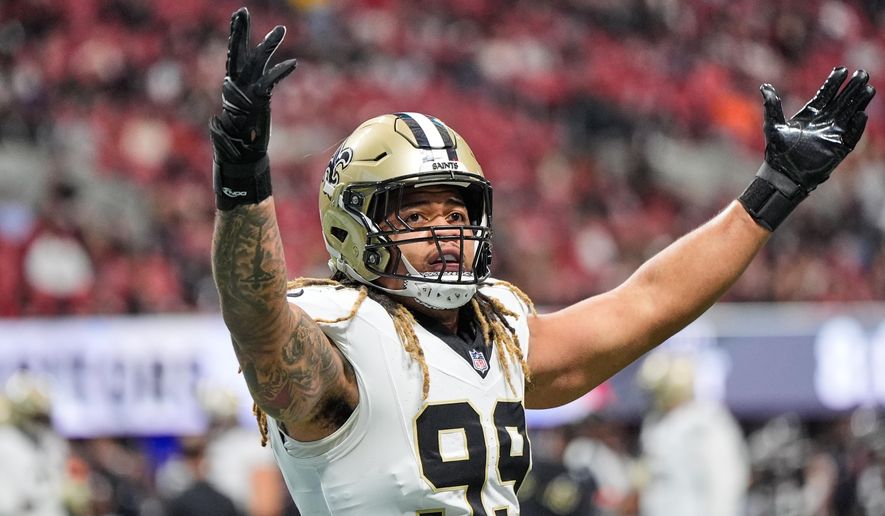 New Orleans Saints defensive end Chase Young (99) celebrates a turnover in the first half of an NFL football game against the Atlanta Falcons, Sunday, Jan. 4, 2026, in Atlanta. (AP Photo/Brynn Anderson) ** FILE **