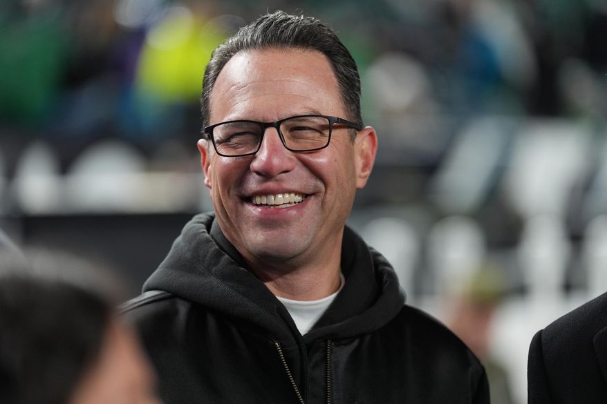 FILE - Pennsylvania Gov. Josh Shapiro watches warm ups before an NFL football game between the Philadelphia Eagles and the Detroit Lions on Sunday, Nov. 16, 2025, in Philadelphia. (AP Photo/Matt Slocum, File)