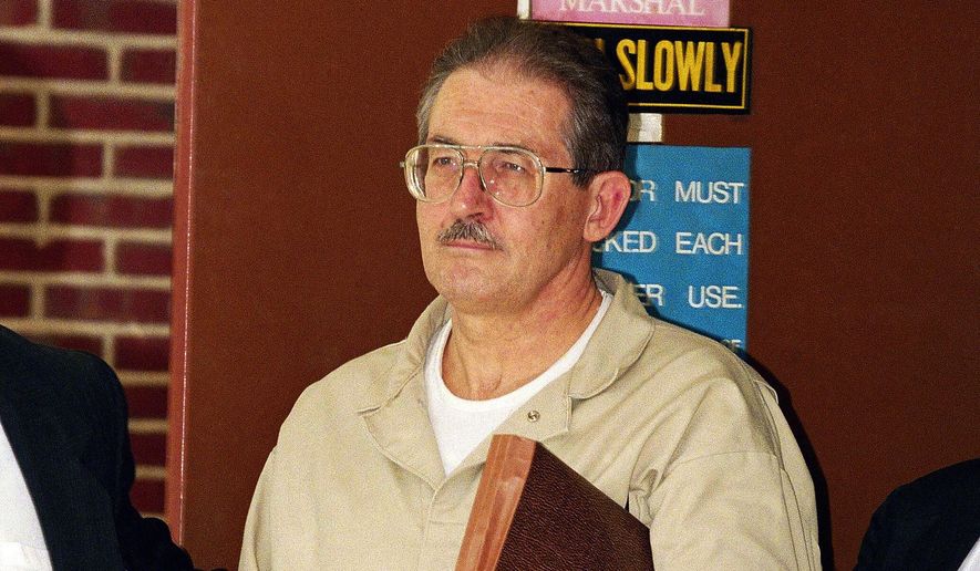 FILE - Former CIA agent Aldrich Ames leaves federal court after pleading guilty to espionage and tax evasion conspiracy charges April 28, 1994, in Alexandria, Va. (AP Photo/Wilfredo Lee, File)