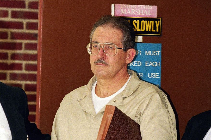 FILE - Former CIA agent Aldrich Ames leaves federal court after pleading guilty to espionage and tax evasion conspiracy charges April 28, 1994, in Alexandria, Va. (AP Photo/Wilfredo Lee, File)