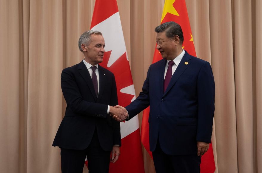 Canadian Prime Minister Mark Carney, left, shakes hands with Chinese President Xi Jinping at the start of a meeting in Gyeongju, South Korea, Oct. 31, 2025. (Adrian Wyld/The Canadian Press via AP, File)