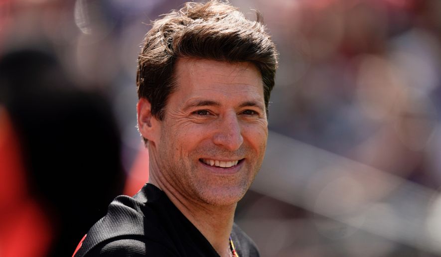 Tony Dokoupil, co-host of "CBS This Morning", looks on before throwing a ceremonial first pitch prior to a baseball game between the Baltimore Orioles and the Texas Rangers, May 27, 2023, in Baltimore. (AP Photo/Julio Cortez, File)