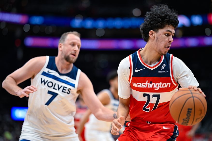 Washington Wizards forward Will Riley (27) dribbles away from Minnesota Timberwolves forward Joe Ingles (7) at Capital One Arena, Washington, D.C., January 4, 2026. (Photo by Brian Murphy for the Washington Times)