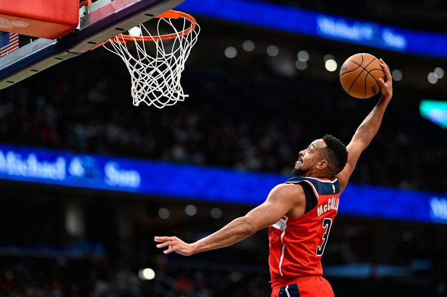 Washington Wizards guard CJ McCollum (3) leaps towards the rim for an uncontested dunk attempt against the Minnesota Timberwolves at Capital One Arena, Washington, D.C., January 4, 2026. (Photo by Brian Murphy for the Washington Times)