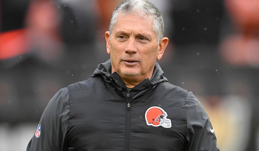 FILE - Cleveland Browns defensive coordinator Jim Schwartz walks on the field before an NFL football game against the Tennessee Titans in Cleveland, Dec. 7, 2025. (AP Photo/David Richard, File)
