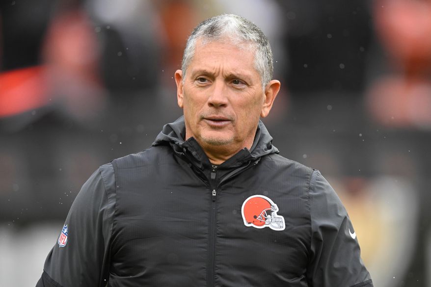 FILE - Cleveland Browns defensive coordinator Jim Schwartz walks on the field before an NFL football game against the Tennessee Titans in Cleveland, Dec. 7, 2025. (AP Photo/David Richard, File)