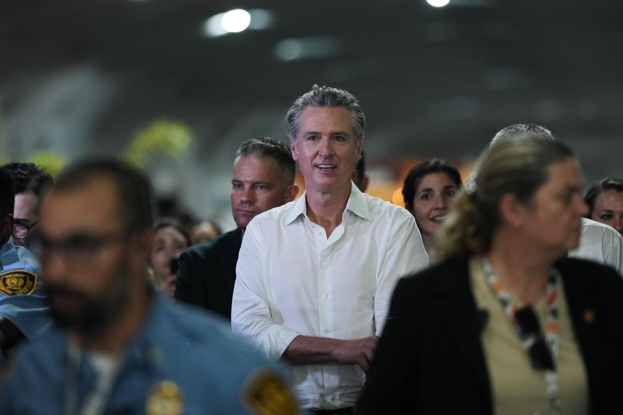 California Gov. Gavin Newsom walks through the venue for the COP30 U.N. Climate Summit, Tuesday, Nov. 11, 2025, in Belem, Brazil. (AP Photo/Andre Penner, File)