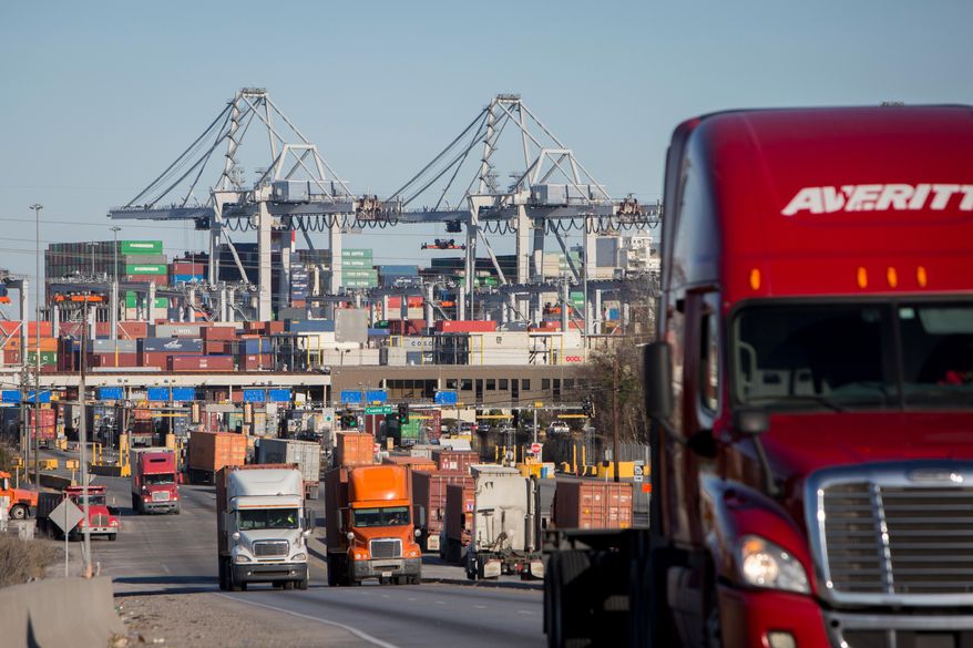 Tractor trailers move cargo out of the Port of Savannah in Savannah, Ga., Jan. 30, 2018. (AP Photo/Stephen B. Morton, File)