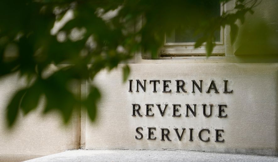 A sign is displayed outside the Internal Revenue Service building May 4, 2021, in Washington. (AP Photo/Patrick Semansky, File)