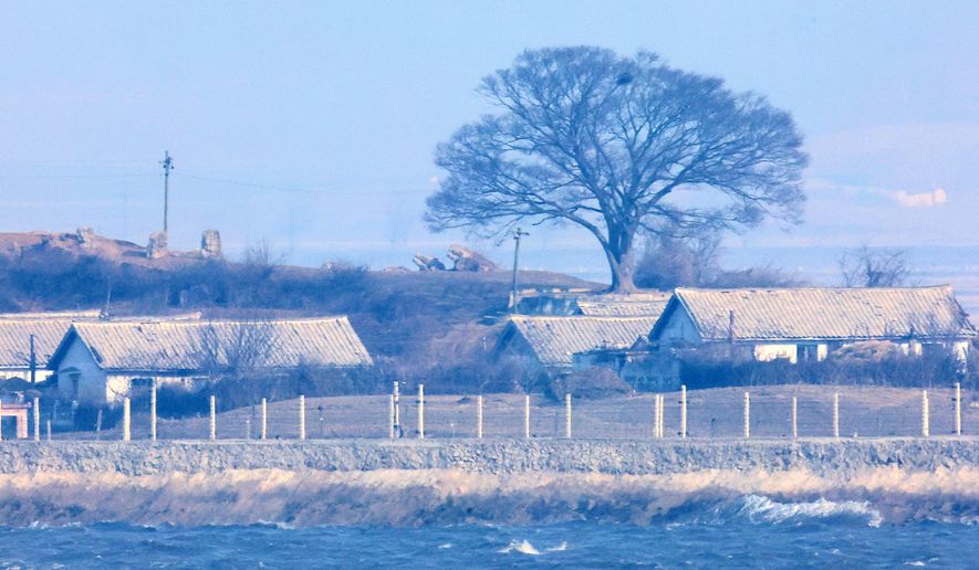 North Korea's Kaepoong village is seen from Ganghwa, South Korea, near the border with North Korea, Saturday, Jan. 10, 2026. (Im Sun-suk/Yonhap via AP)