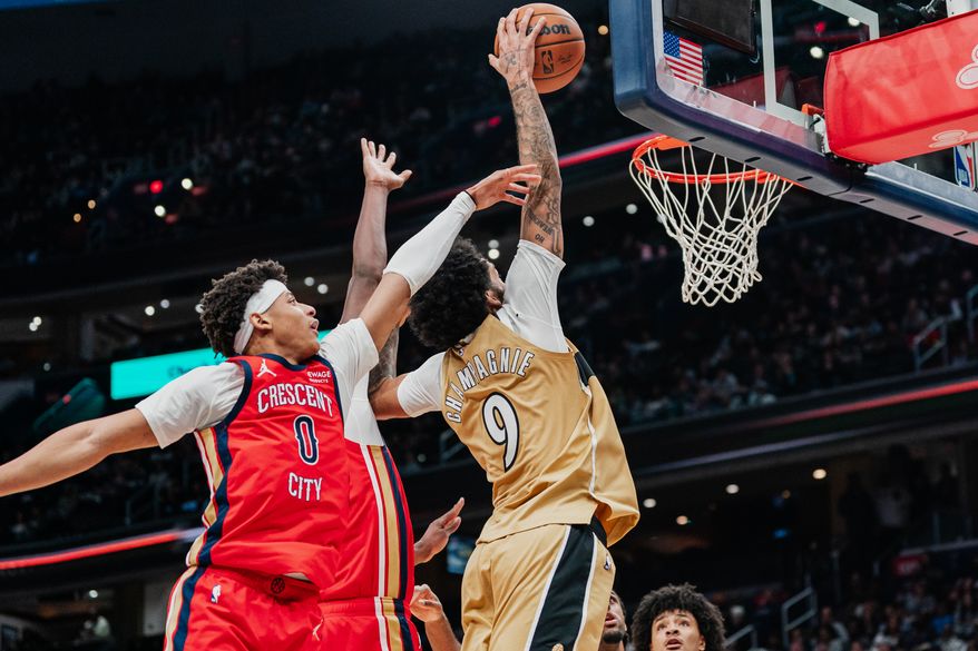 Washington Wizards Forward Justin Champagnie (9) dribbles past defenders and dunks at Capital One Arena, Washington, D.C., January 9th, 2026. Washington Wizards fall to the New Orleans Pelicans 128-107. (Photo by Jordan Sabillo, for the Washington Times)