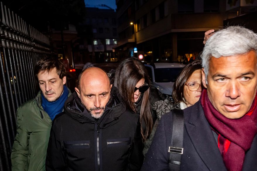 The owners of the "Le Constellation" bar in Crans-Montana, where the deadly fire happened on New Year's Day, Jacques und Jessica Moretti from France, center, arrive with their lawyers Patrick Michod, Yael Hayat and Nicola Meier, to be auditioned by the Valais public prosecutor's office in Sion, Switzerland, Friday, January 9, 2026. (Jean-Christophe Bott/Keystone via AP)