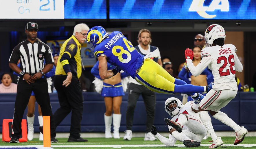 Los Angeles Rams tight end Colby Parkinson (84) dives into the end zone for a touchdown during the second half of an NFL football game against the Arizona Cardinals, Sunday, Jan. 4, 2026, in Inglewood, Calif. (AP Photo/Jessie Alcheh)