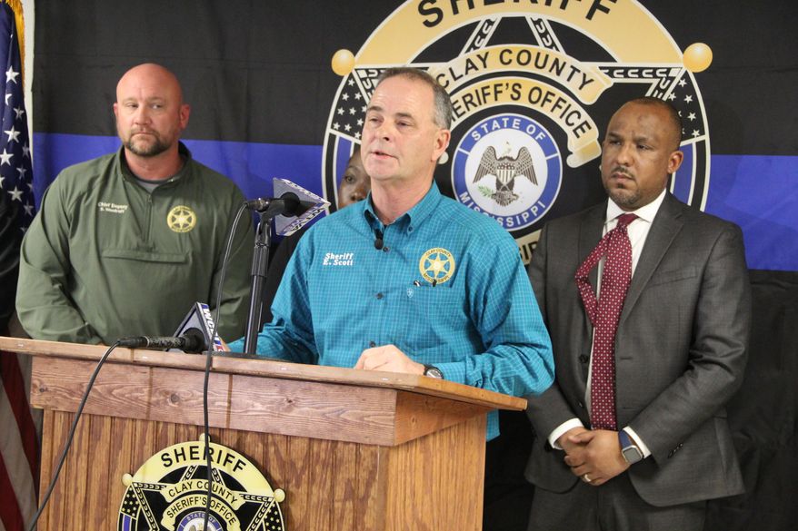 Clay County Sheriff Eddie Scott speaks during a news conference in West Point, Miss., on Saturday, Jan. 10, 2026, accompanied by Chief Deputy Steven "Woody" Woodruff, left, and Clay County District Attorney Scott Colom, right, after Friday night shootings at three locations. (Braden Simmons/The Commercial Dispatch via AP)