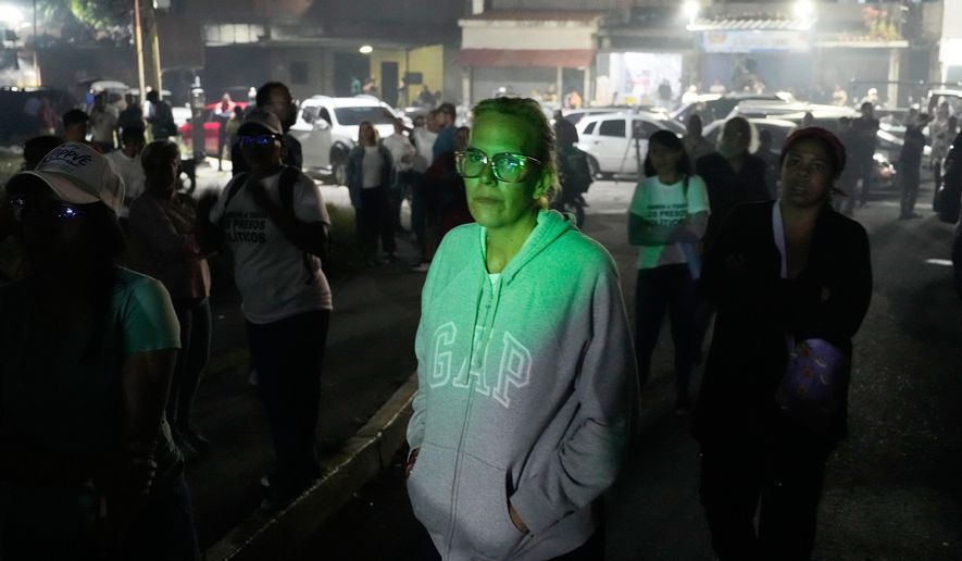 Mariana Gonzalez, the daughter of opposition leader Edmundo Gonzalez, whose husband is detained, waits outside the Rodeo I prison in Guatire, Venezuela, Thursday, Jan. 8, 2026, after National Assembly President Jorge Rodriguez said the government would release Venezuelan and foreign prisoners. (AP Photo/Matias Delacroix)