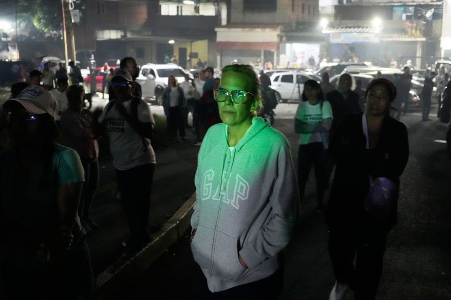 Mariana Gonzalez, the daughter of opposition leader Edmundo Gonzalez, whose husband is detained, waits outside the Rodeo I prison in Guatire, Venezuela, Thursday, Jan. 8, 2026, after National Assembly President Jorge Rodriguez said the government would release Venezuelan and foreign prisoners. (AP Photo/Matias Delacroix)