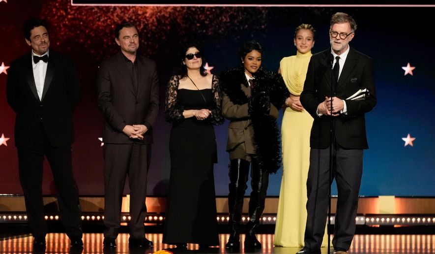 Benicio del Toro, from left, Leonardo DiCaprio, Cassandra Kulukundis, Teyana Taylor, Chase Infiniti, and Paul Thomas Anderson accept the award for best picture for "One Battle After Another" during the 31st Annual Critics Choice Awards on Sunday, Jan. 4, 2026, at The Barker Hanger in Santa Monica, Calif. (AP Photo/Chris Pizzello)