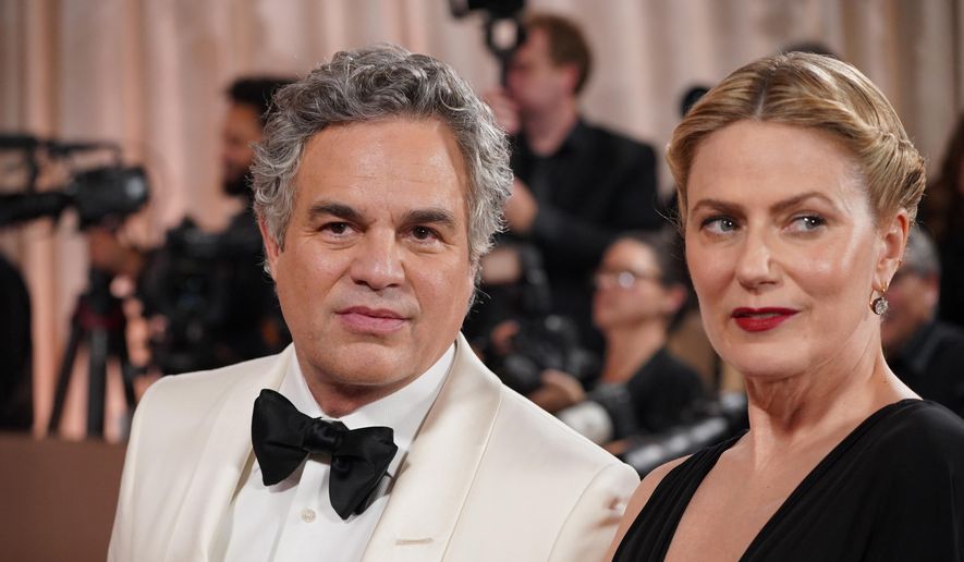 Mark Ruffalo, left, and Sunrise Coigney arrive at the 83rd Golden Globes on Sunday, Jan. 11, 2026, at the Beverly Hilton in Beverly Hills, Calif. (Photo by Jordan Strauss/Invision/AP)