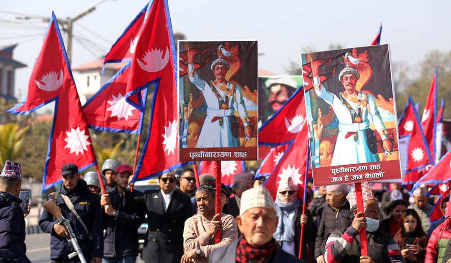 Supporters of Nepal's former royal family participate in a rally demanding the restoration of the monarchy as they mark the birth anniversary of the 18th century king Prithivi Narayan Shah, founder of the Shah dynasty, in Katmandu, Nepal, Sunday, Jan. 11, 2026. (AP Photo/Subash Shrestha)