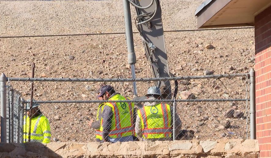 A still frame from video showed crews with El Paso Water working to restore services after a water main break on Sunday, Jan. 11, 2026, in El Paso, Texas. (KFOX News via AP)