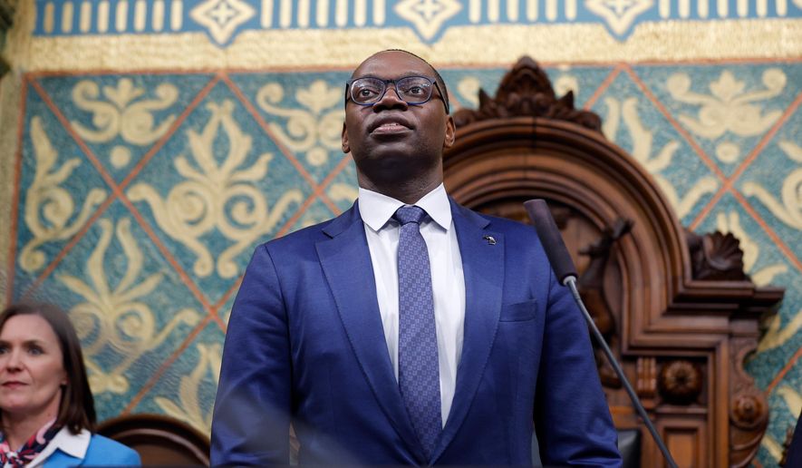 FILE - Michigan Lt. Gov. Garlin Gilchrist II waits before the State of the State address, Wednesday, Jan. 24, 2024, at the state Capitol in Lansing, Mich. (AP Photo/Al Goldis, file)