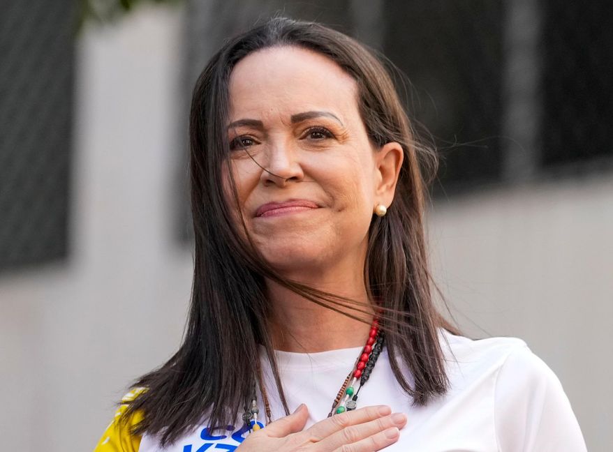 Opposition leader Maria Corina Machado gestures to supporters during a protest against President Nicolas Maduro the day before his inauguration for a third term, in Caracas, Venezuela, Thursday, Jan. 9, 2025. (AP Photo/Ariana Cubillos, file)