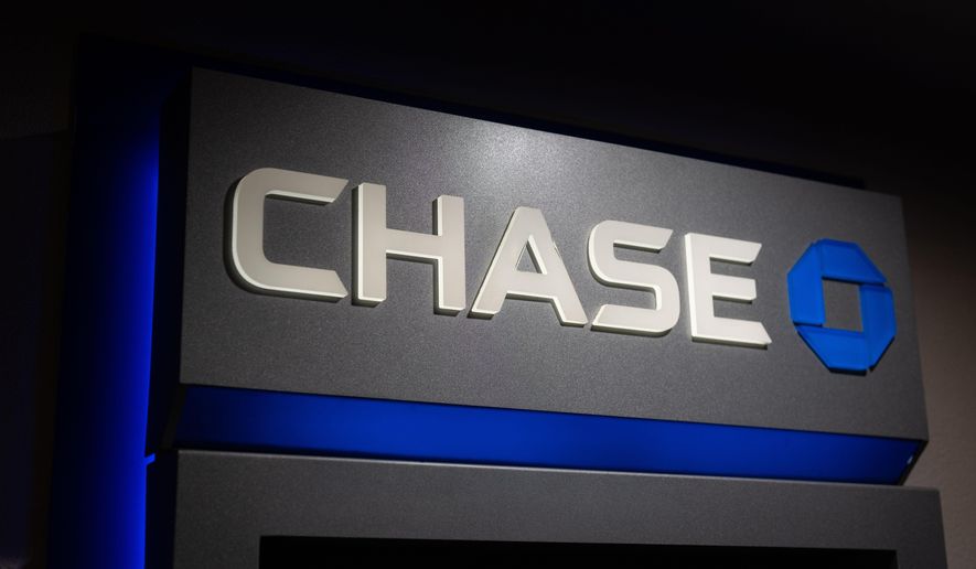 A sign for Chase bank is seen on an ATM Tuesday, Jan. 6, 2026, in Portland, Ore. (AP Photo/Jenny Kane)