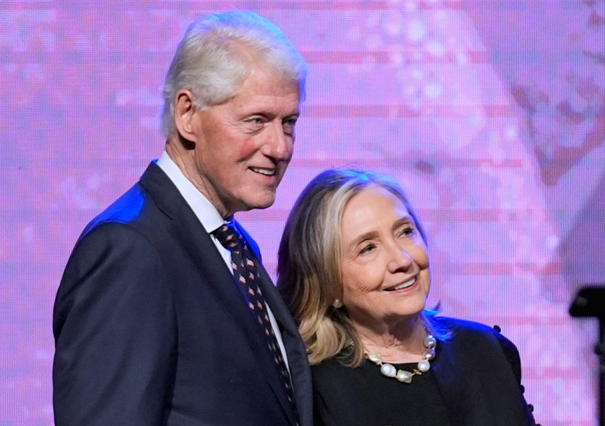 Former President Bill Clinton, left, and former Secretary of State Hillary Clinton listen as Vice President Kamala Harris delivers a eulogy for U.S. Rep.†Sheila Jackson Lee, Aug. 1, 2024, in Houston. (AP Photo/LM Otero, File)
