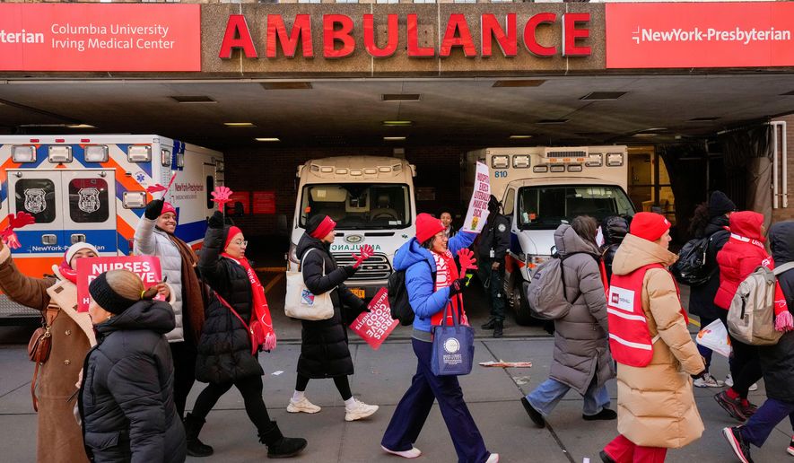 Nurses strike outside New York-Presbyterian Hospital, Monday, Jan. 12, 2026, in New York. (AP Photo/Yuki Iwamura)