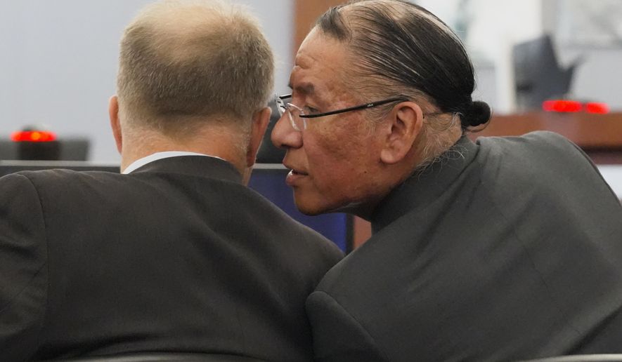 Nathan Chasing Horse, right, talks to his attorney Craig Mueller during his trial on charges of sexually abusing Indigenous women and girls Tuesday, Jan. 13, 2026, in Las Vegas. (AP Photo/Ty ONeil)