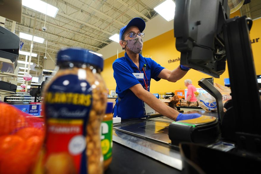 A cashier rings up groceries in Dallas, Aug. 28, 2025. (AP Photo/LM Otero, File)