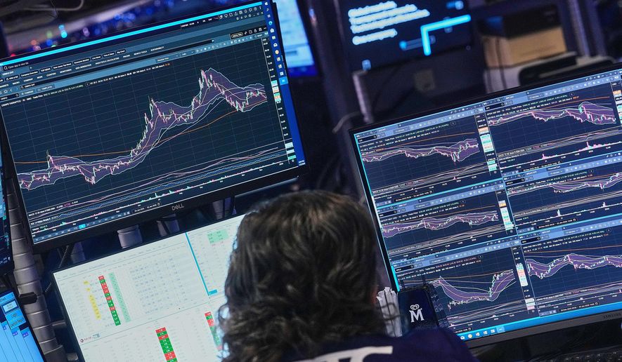 Specialist Michael Pistillo works at his post on the floor of the New York Stock Exchange, Friday, Jan. 2, 2026. (AP Photo/Richard Drew)