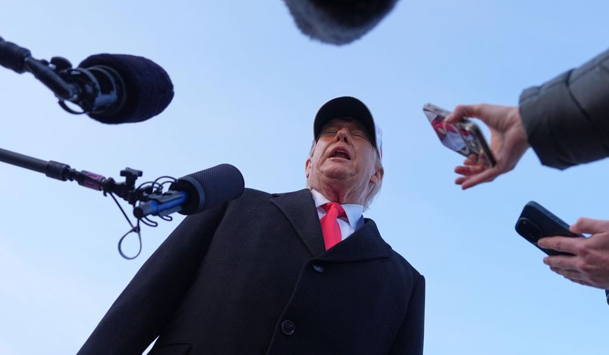 President Donald Trump speaks with reporters at Joint Base Andrews, Tuesday, Jan. 13, 2026, in Joint Base Andrews, Md. (AP Photo/Evan Vucci)