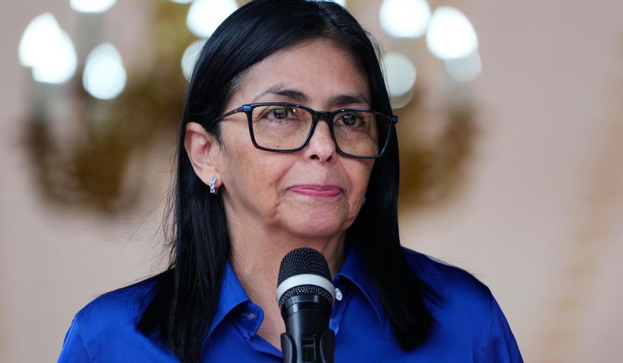 Venezuela's acting President Delcy Rodriguez makes a statement to the press at Miraflores presidential palace in Caracas, Venezuela, Wednesday, Jan. 14, 2026. (AP Photo/Ariana Cubillos)