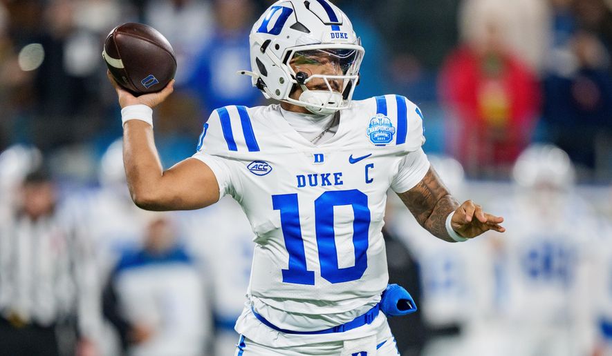 FILE - Duke quarterback Darian Mensah looks to pass the ball against Virginia in the first half of the Atlantic Coast Conference championship NCAA college football game in Charlotte, N.C., Dec. 6, 2025. (AP Photo/Jacob Kupferman)